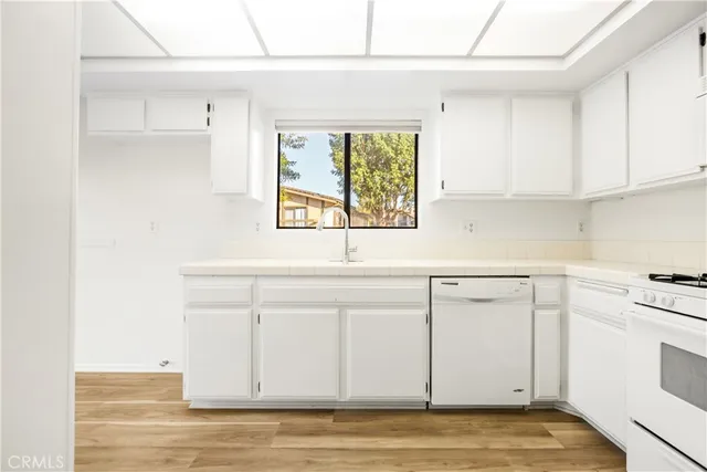 a view of a kitchen with wooden floor