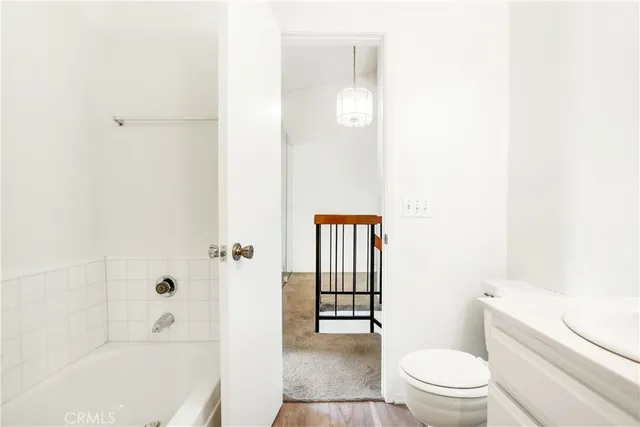 a bathroom with a bathtub and toilet