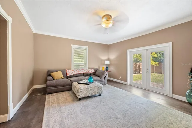 a living room with couch and a flat screen tv