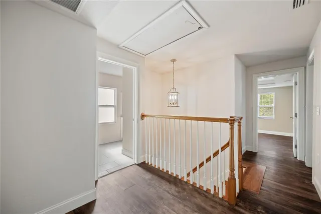 a view of a house with backyard porch and sitting area