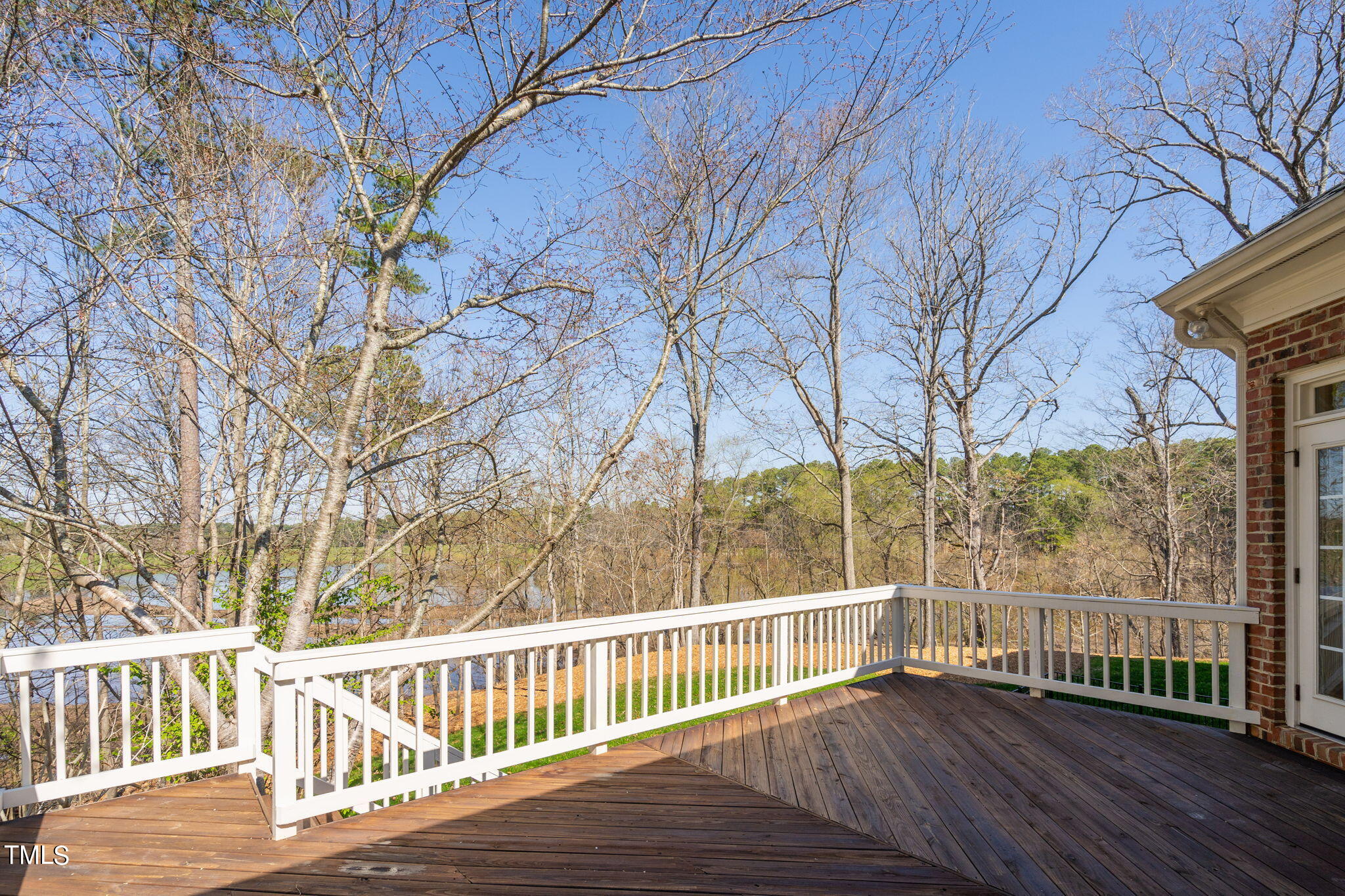205 Grey Bridge Row Cary, NC 27513 - Photo 3 of 5 a view of a wooden deck next to a yard