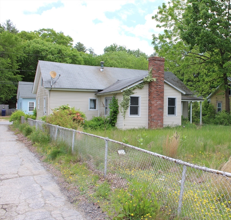 3 Ledge Street Sutton, MA 01590 - Photo 1 of 12 a front view of a house with a yard