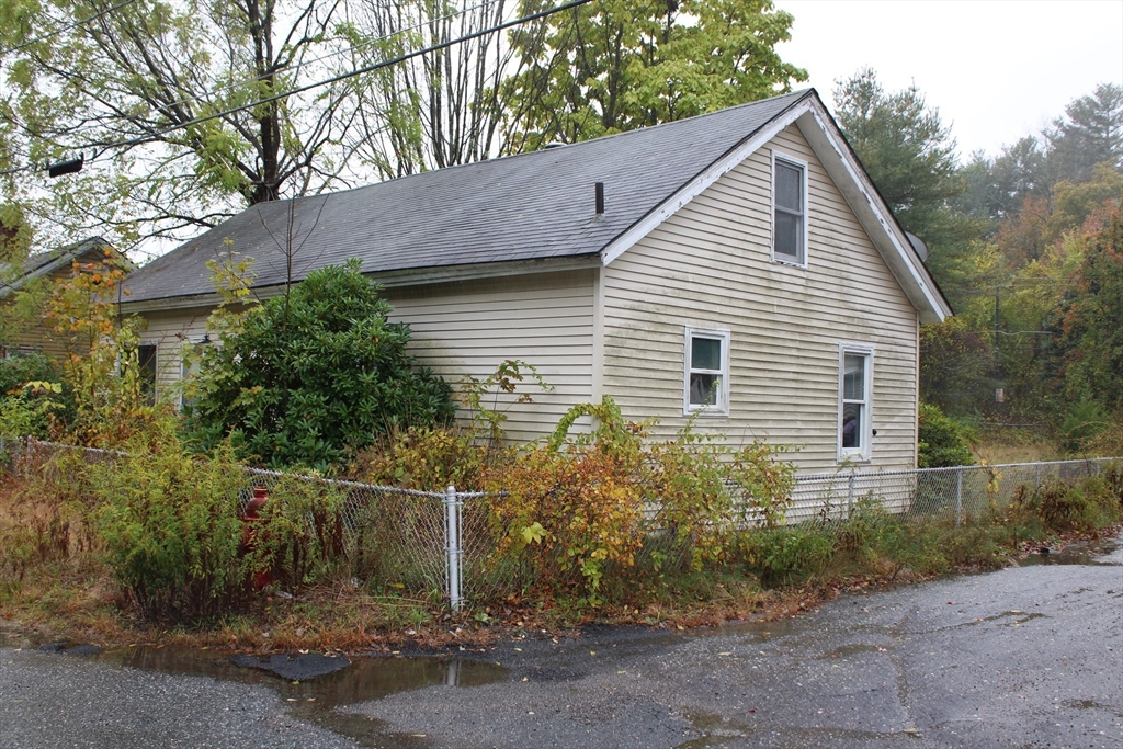 3 Ledge Street Sutton, MA 01590 - Photo 3 of 12 a view of a house with large trees