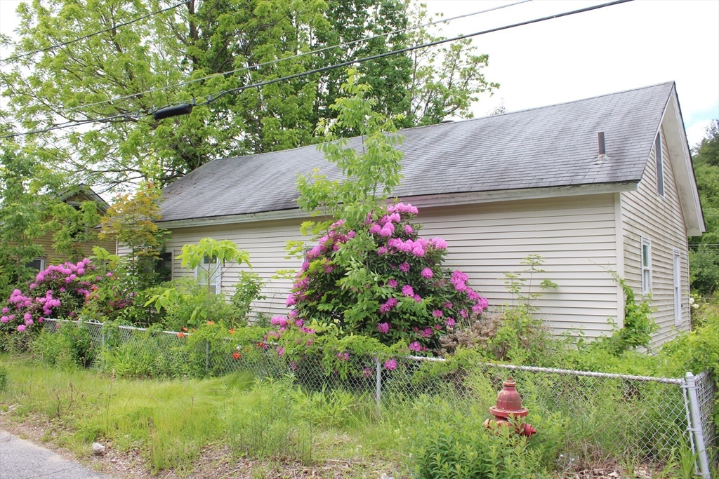 3 Ledge Street Sutton, MA 01590 - Photo 4 of 12 a small garden covered with tall trees