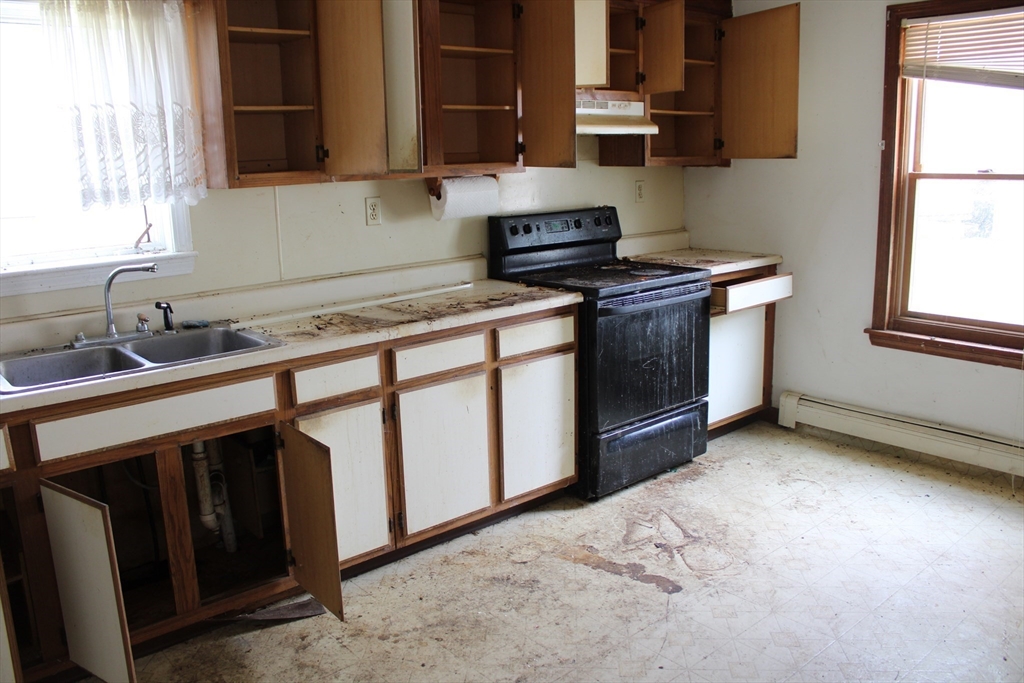 3 Ledge Street Sutton, MA 01590 - Photo 5 of 12 a kitchen that has a sink and a stove