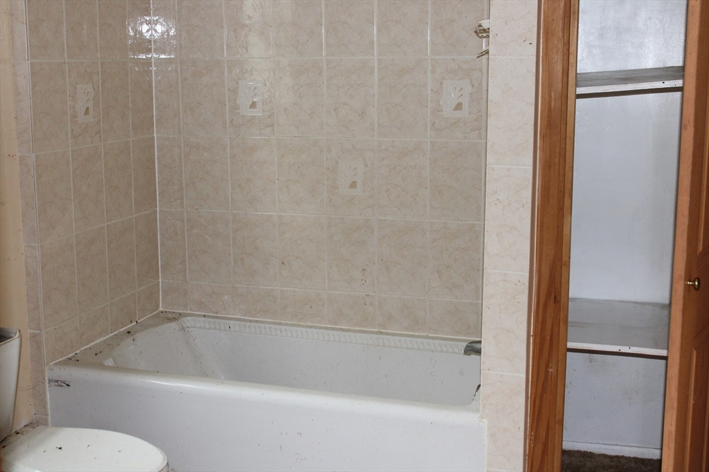 3 Ledge Street Sutton, MA 01590 - Photo 7 of 12 a bathroom with a bathtub and a toilet