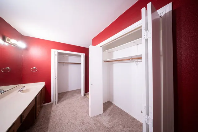 a view of a livingroom with a dresser and entryway
