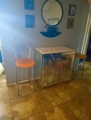 a room with a table and chairs