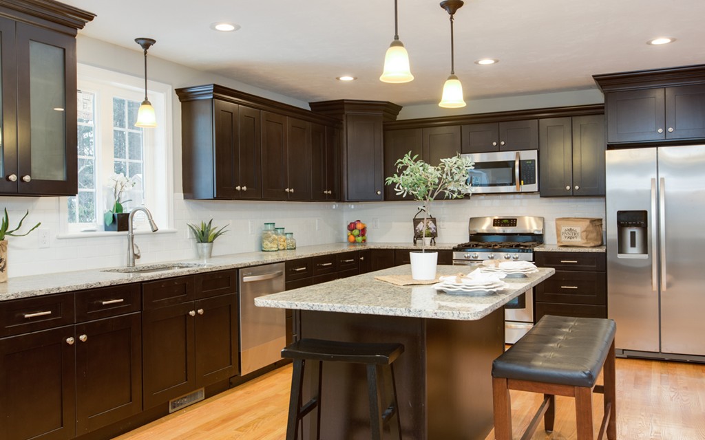 21 Sylvan Road Billerica, MA 01821 - Photo 10 of 30 a kitchen with granite countertop a sink stove and refrigerator