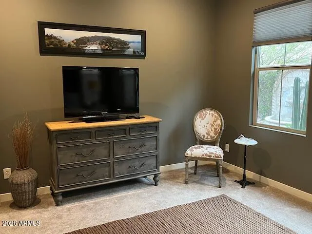 a living room with furniture a window and a fireplace