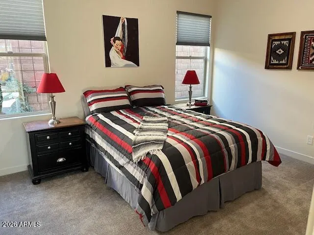 a bedroom with a bed and lamp