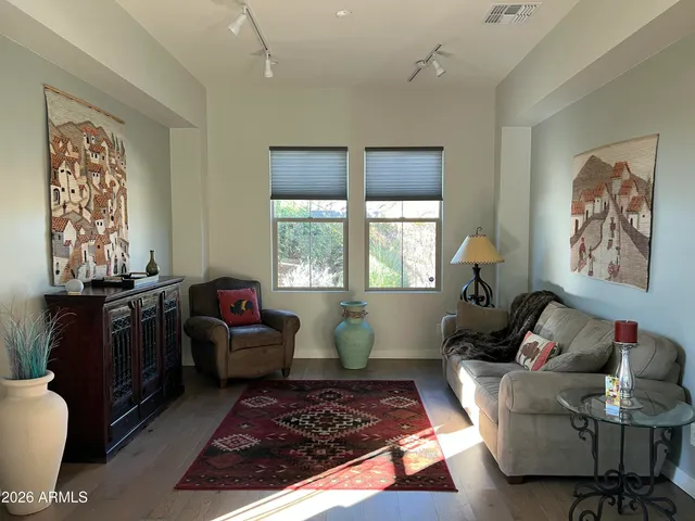 a living room with furniture and a window