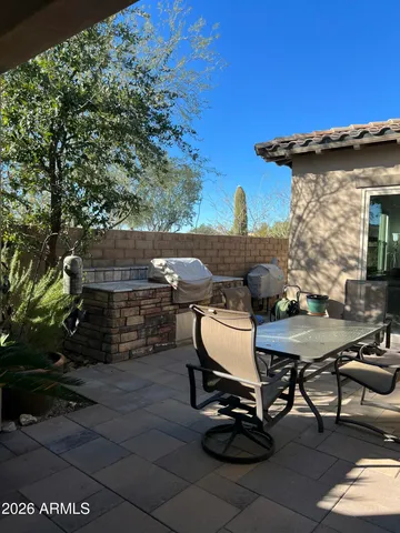 a view of backyard with sitting area