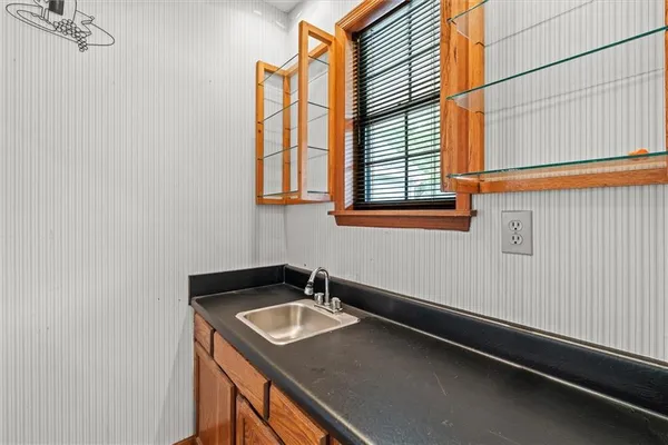 a bathroom with a sink and a window