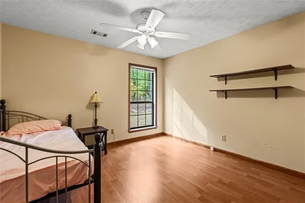 a view of a room with furniture window and wooden floor