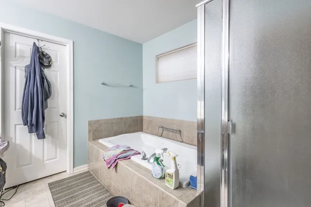 a en suite bathroom with a sink and mirror
