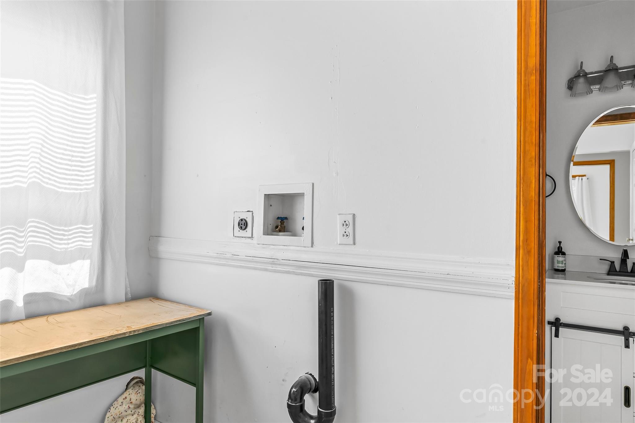 3840 Hide Away Hill Valdese, NC 28690 - Photo 14 of 21 a bathroom with a sink and a mirror