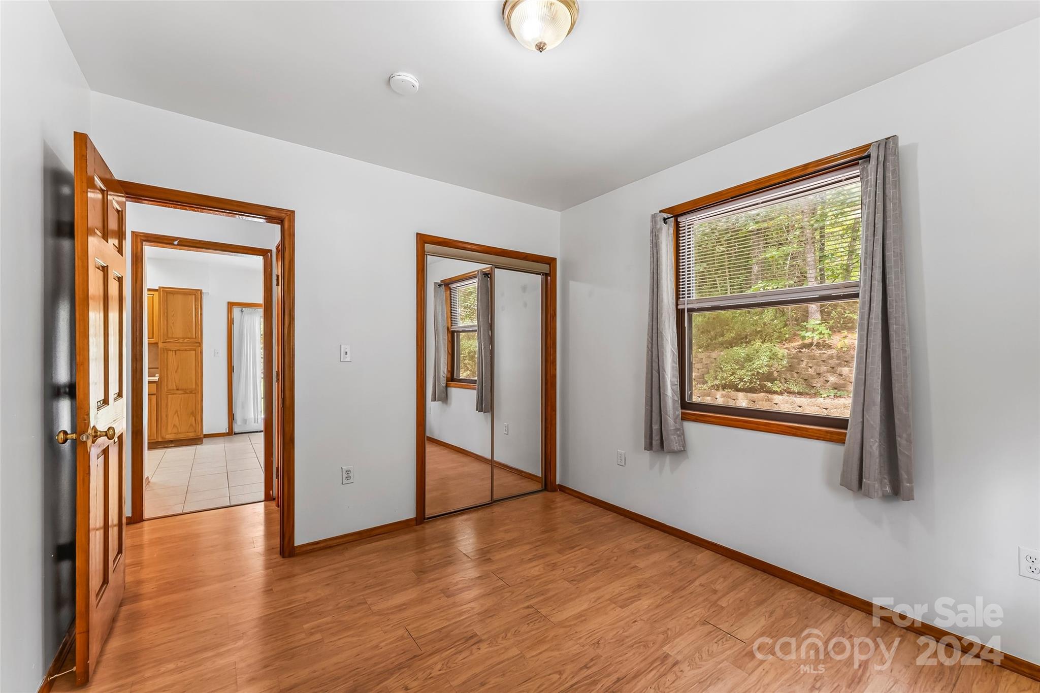 3840 Hide Away Hill Valdese, NC 28690 - Photo 19 of 21 an empty room with wooden floor and windows