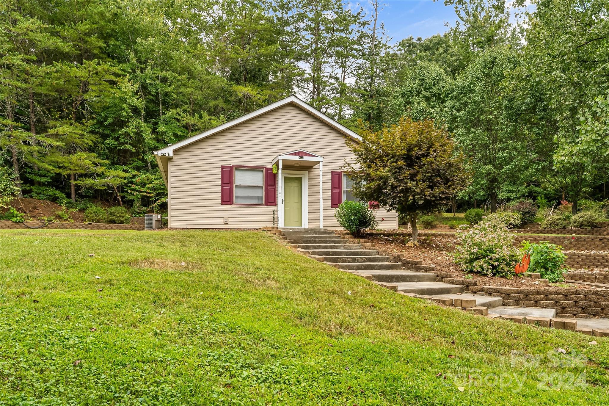 3840 Hide Away Hill Valdese, NC 28690 - Photo 3 of 21 a view of a house with a yard and trees