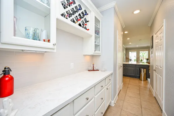 a spacious bathroom with a mirror sink and bathtub