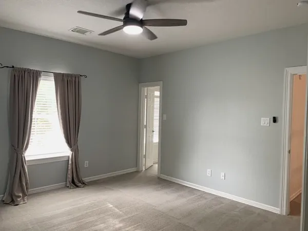 a view of living room with furniture and floor to ceiling window