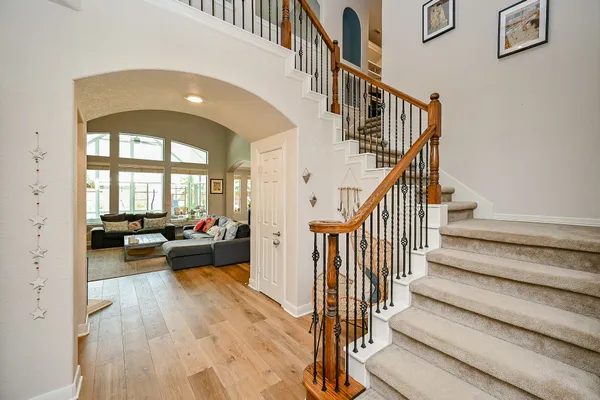 a large kitchen with stainless steel appliances lots of counter space and windows