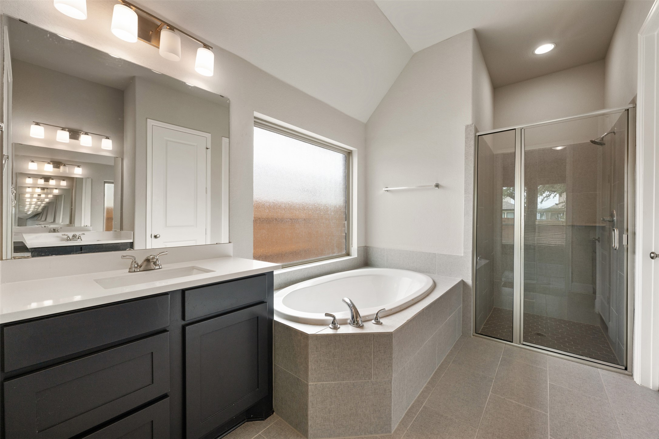 104 Anejo Bluff Georgetown, TX 78628 - Photo 29 of 40 a bathroom with a sink and a mirror