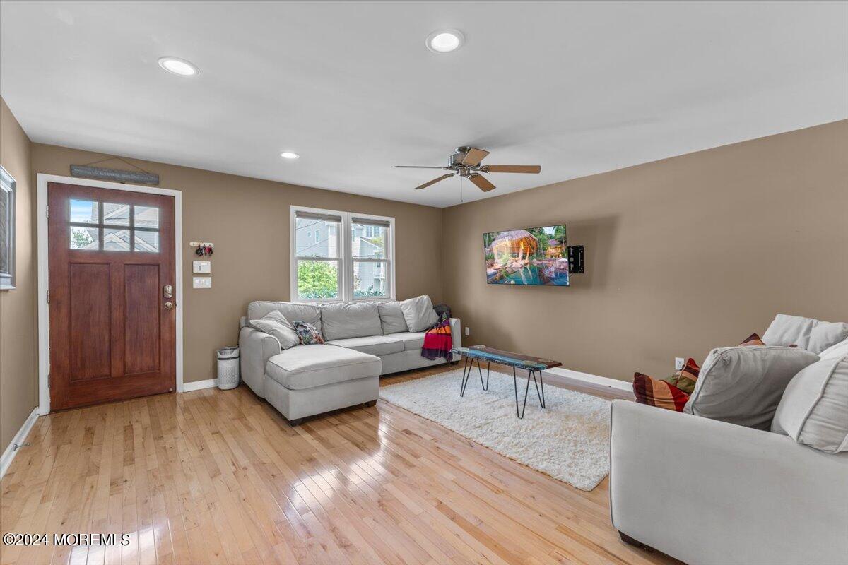 54 Metedeconk Road Brick, NJ 08723 - Photo 11 of 35 a living room with furniture and a wooden floor