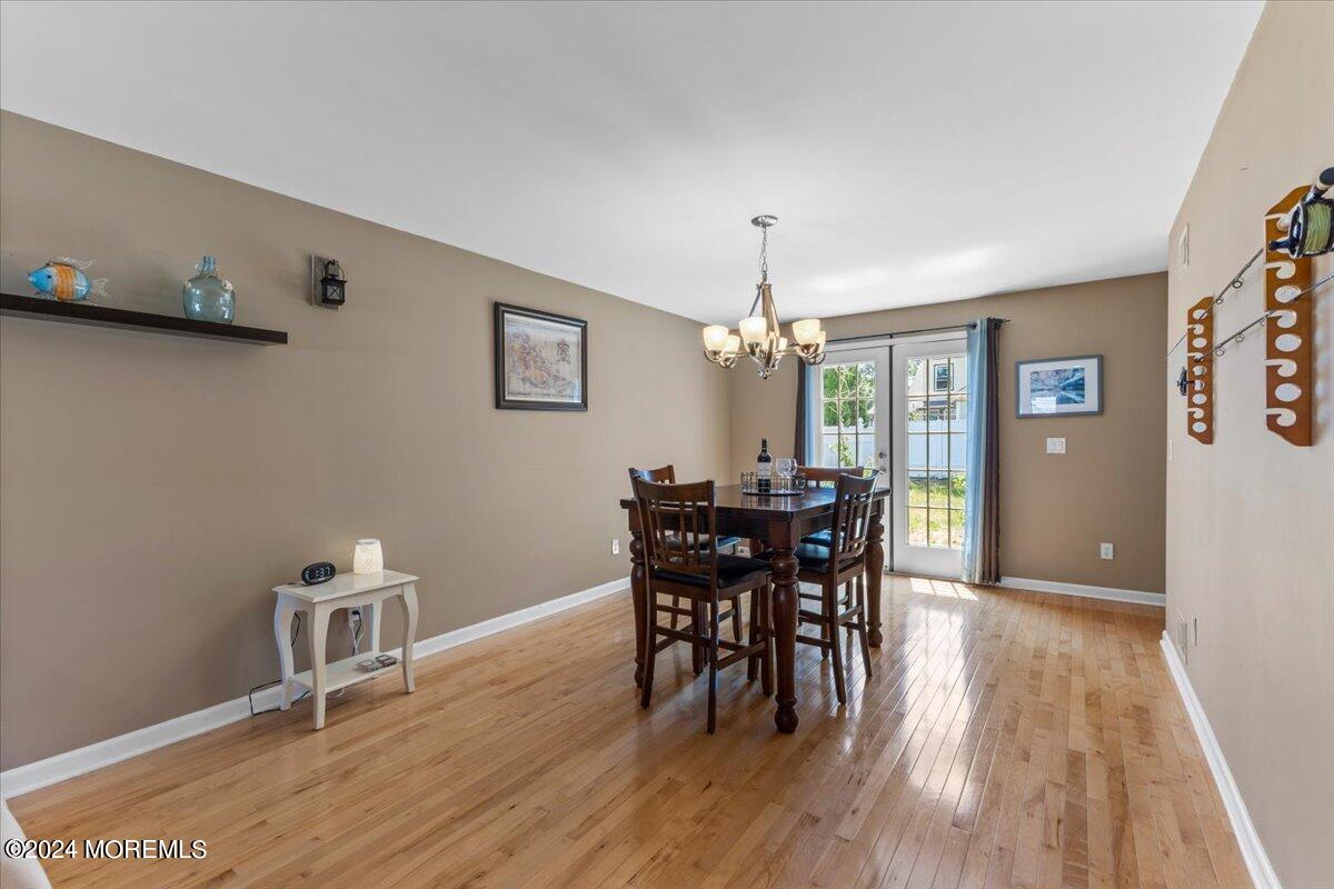 54 Metedeconk Road Brick, NJ 08723 - Photo 14 of 35 a view of a dining room with furniture and wooden floor