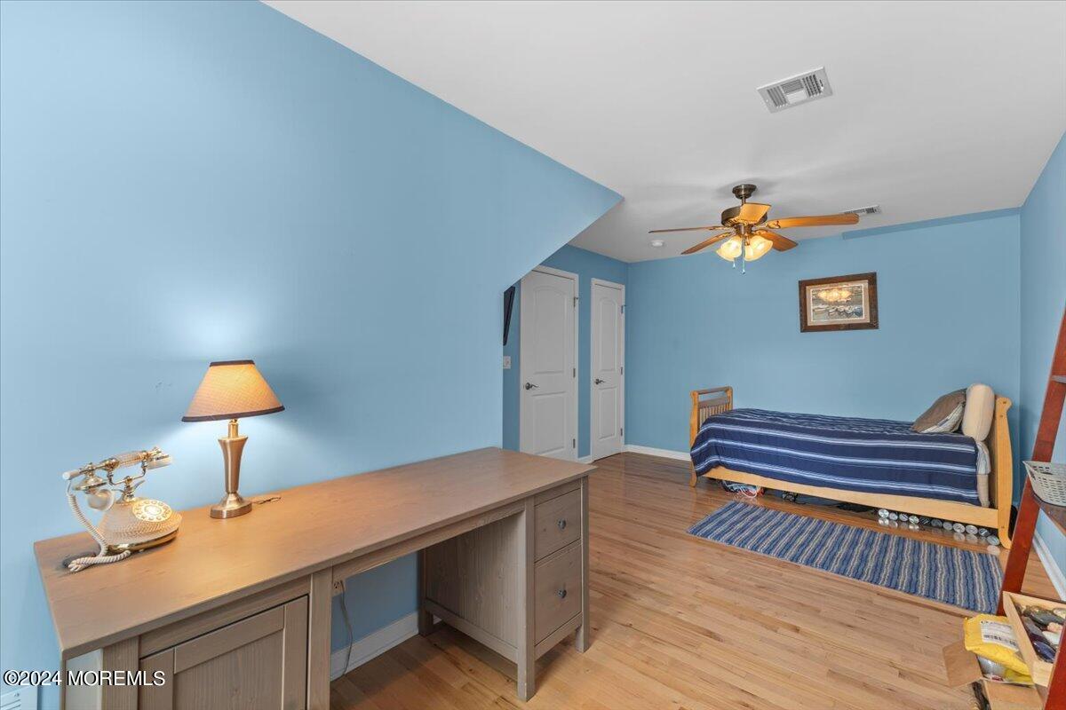 54 Metedeconk Road Brick, NJ 08723 - Photo 29 of 35 a bedroom with a bed and a lamp on the table