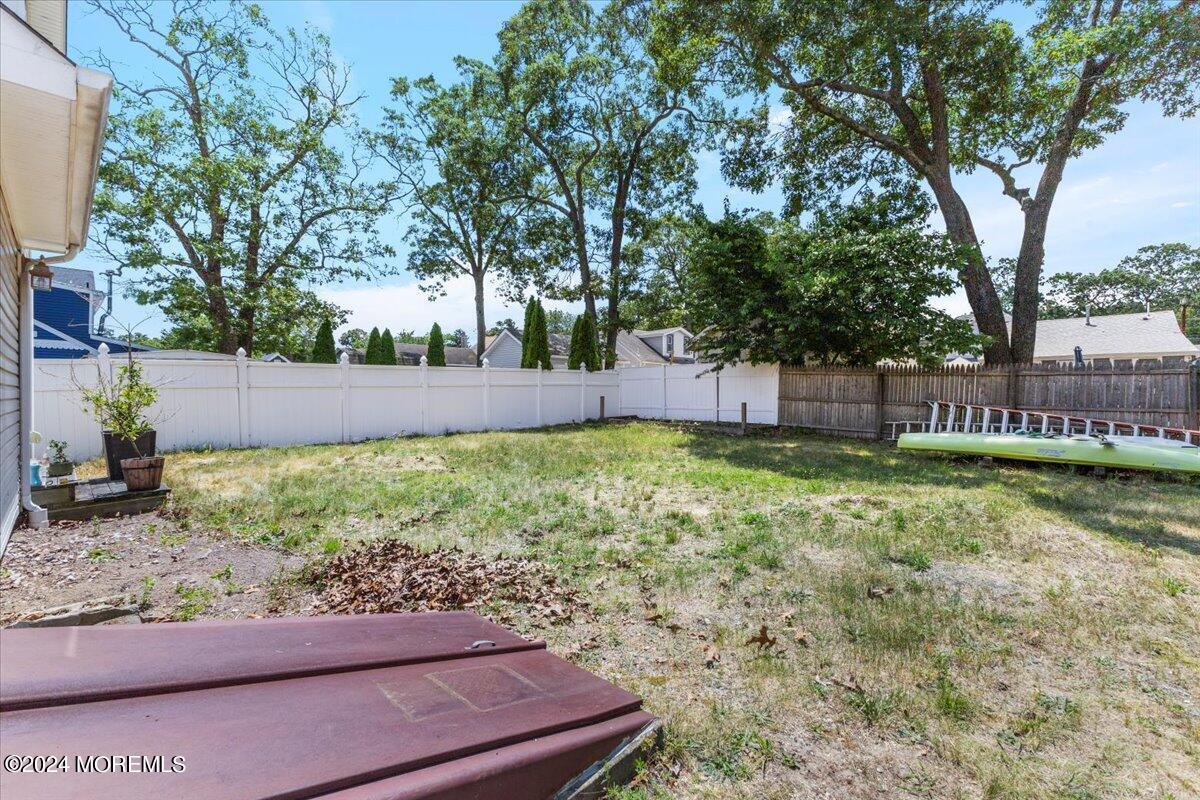 54 Metedeconk Road Brick, NJ 08723 - Photo 30 of 35 a view of a backyard with a garden