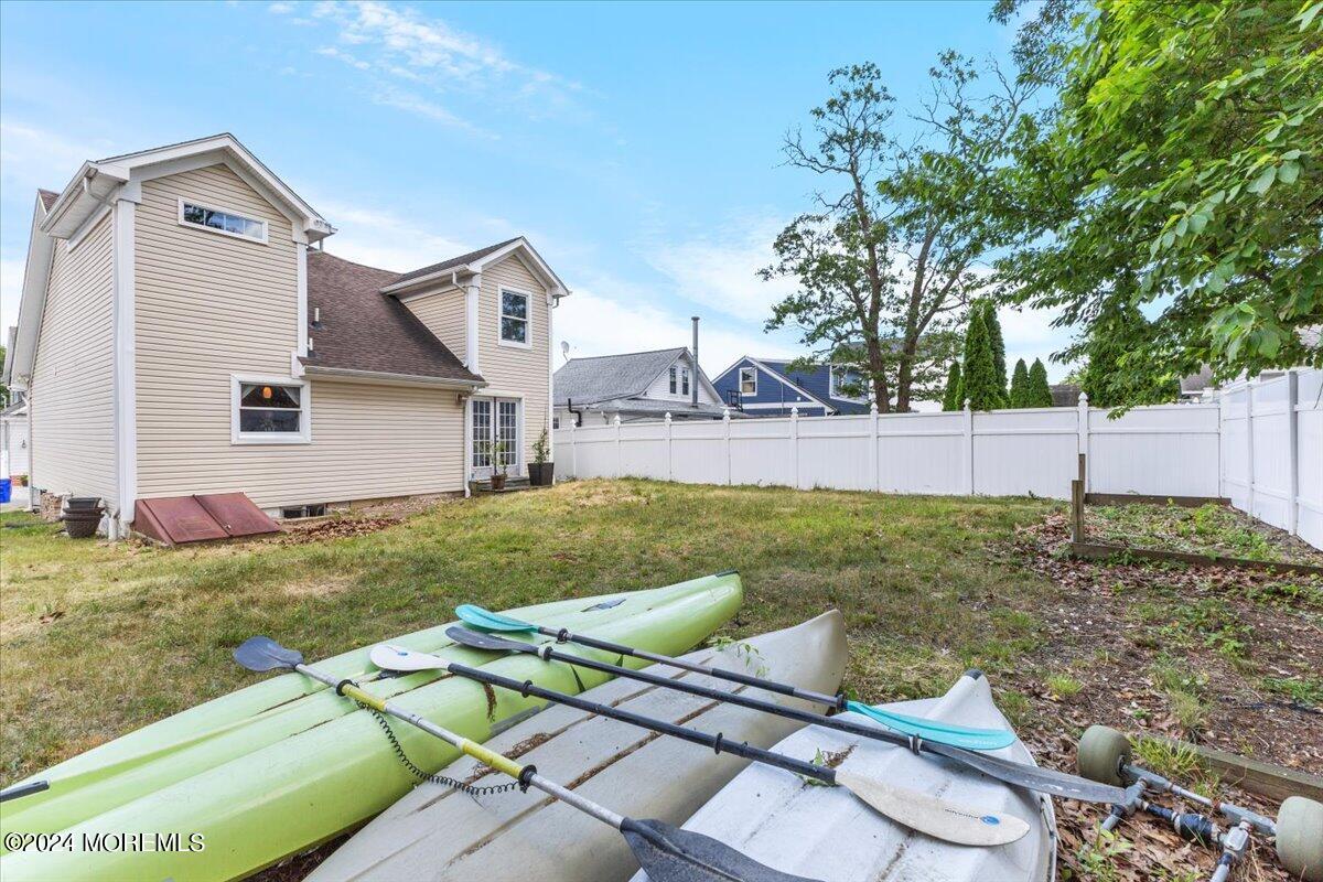 54 Metedeconk Road Brick, NJ 08723 - Photo 31 of 35 a view of backyard with house and outdoor seating