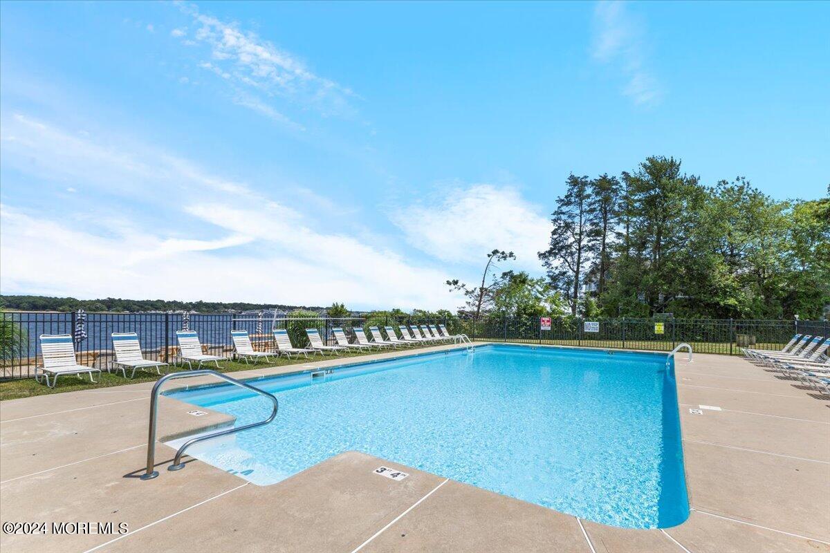 54 Metedeconk Road Brick, NJ 08723 - Photo 33 of 35 a view of swimming pool with a patio