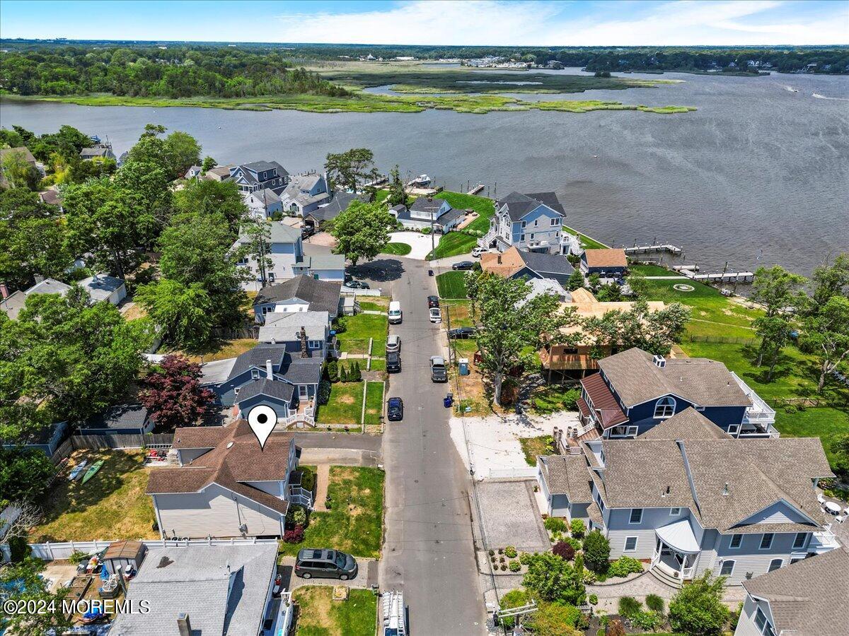 54 Metedeconk Road Brick, NJ 08723 - Photo 7 of 35 an aerial view of a city with lake view