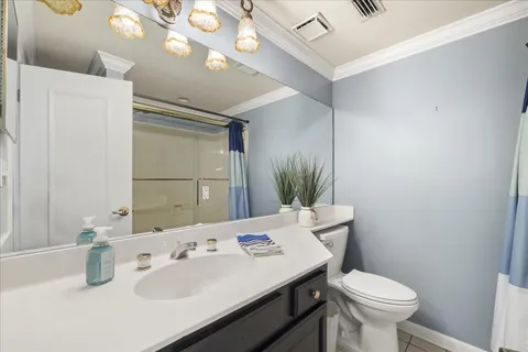 a large kitchen with a table and chairs