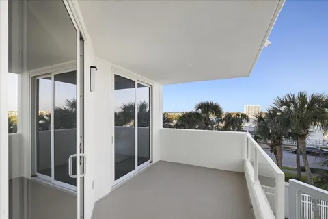 a balcony with furniture and city view