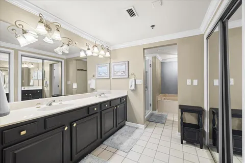 a white bath tub sitting next to a shower