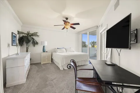 a bedroom with a bed and a chair