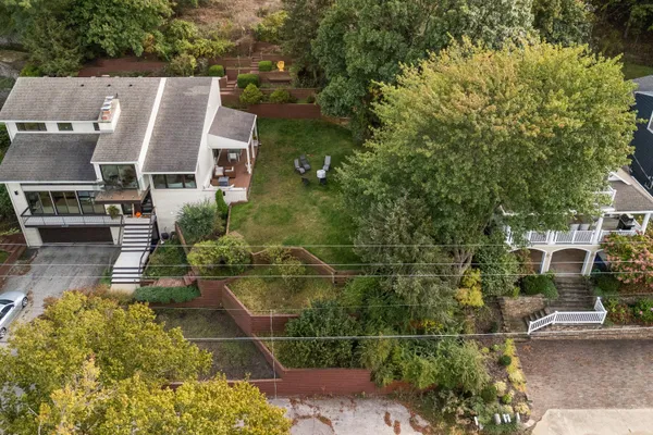 an aerial view of residential houses with outdoor space