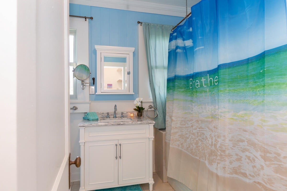 1111 Kealoha Road Kapaa, HI 96746 - Photo 12 of 30 a bathroom with a sink and a mirror