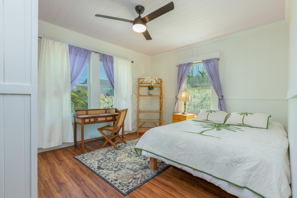 1111 Kealoha Road Kapaa, HI 96746 - Photo 10 of 30 a bedroom with a bed a window and dresser