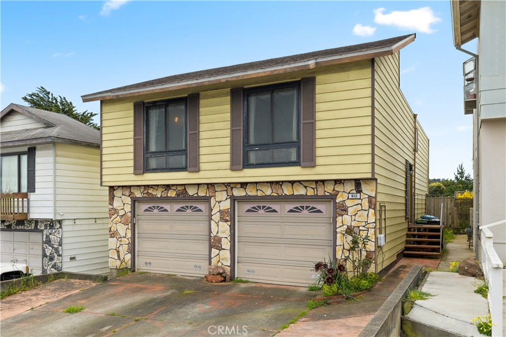a front view of a house with a garage