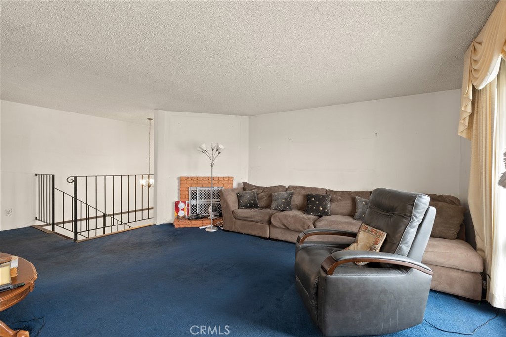 912 Gellert Boulevard Daly City, CA 94015 - Photo 6 of 21 a living room with furniture and a couch