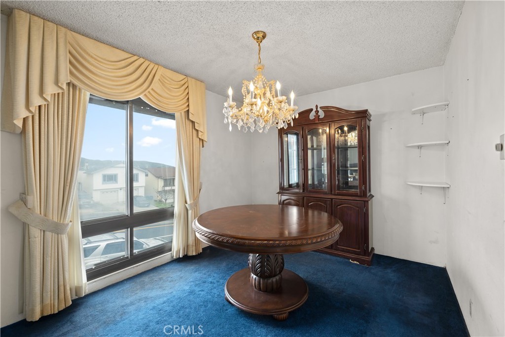 912 Gellert Boulevard Daly City, CA 94015 - Photo 7 of 21 a room with chandelier fan and windows