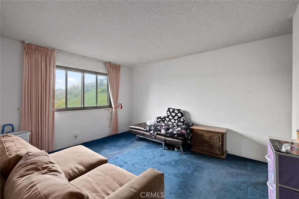912 Gellert Boulevard Daly City, CA 94015 - Photo 10 of 21 a living room with furniture and a window