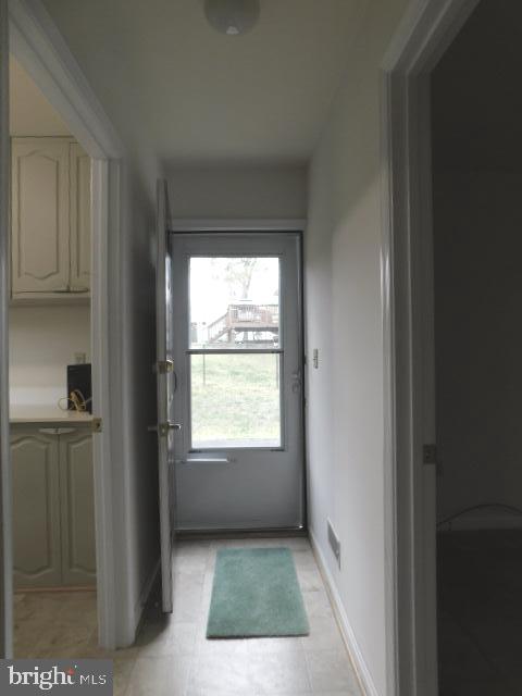 5013 Decatur Street St. Leonard, MD 20685 - Photo 12 of 45 a view of an empty room with a kitchen