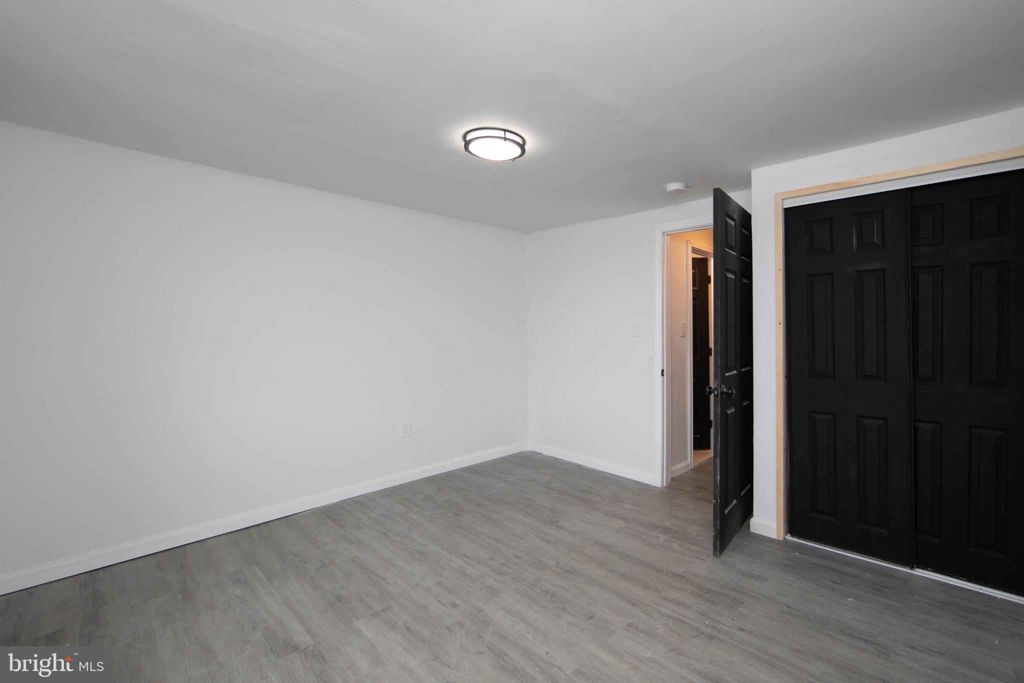 1261 South Merrimac Road Camden, NJ 08104 - Photo 13 of 27 wooden floor in an empty room