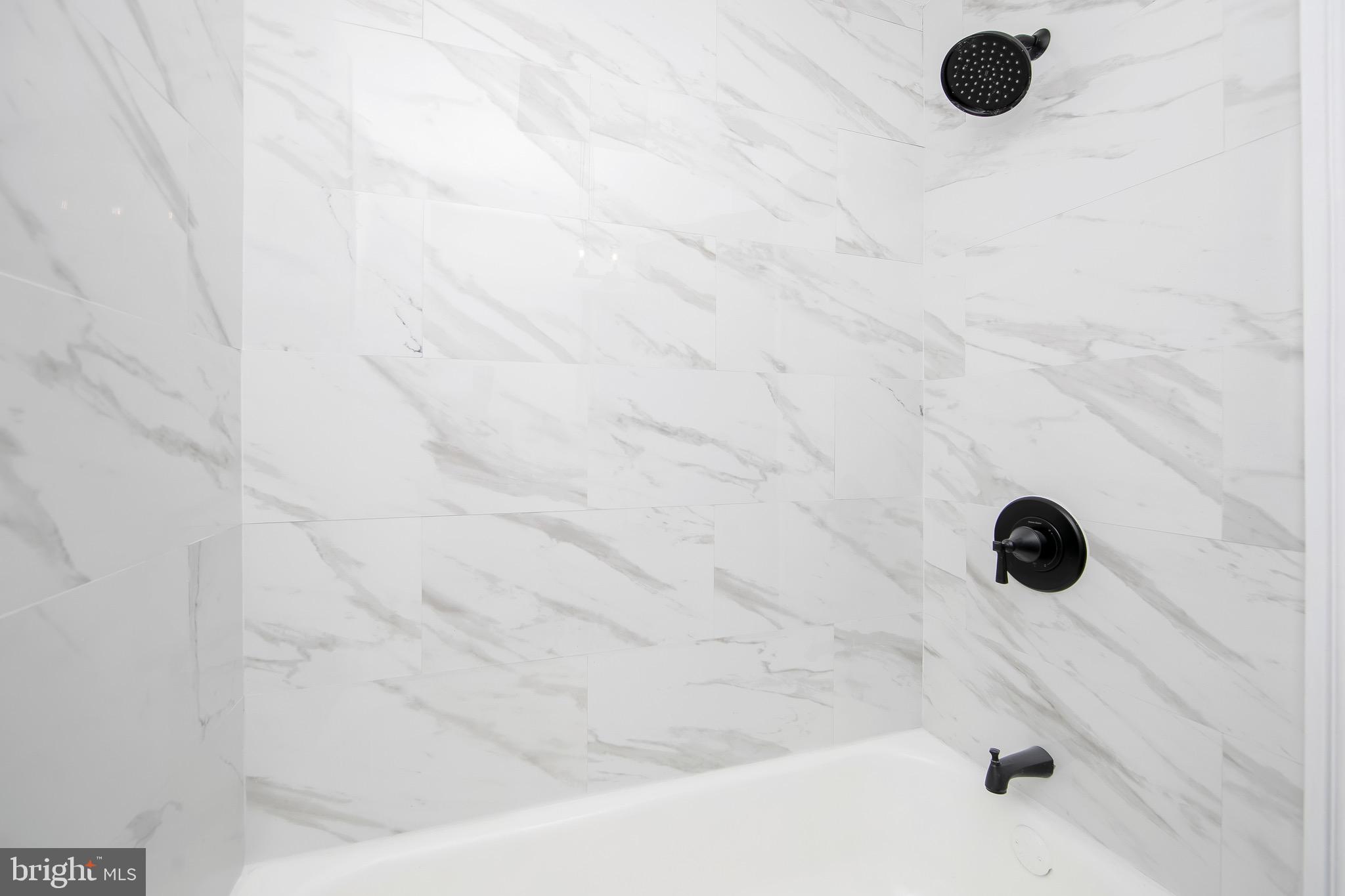 1261 South Merrimac Road Camden, NJ 08104 - Photo 17 of 27 a bathroom with a shower