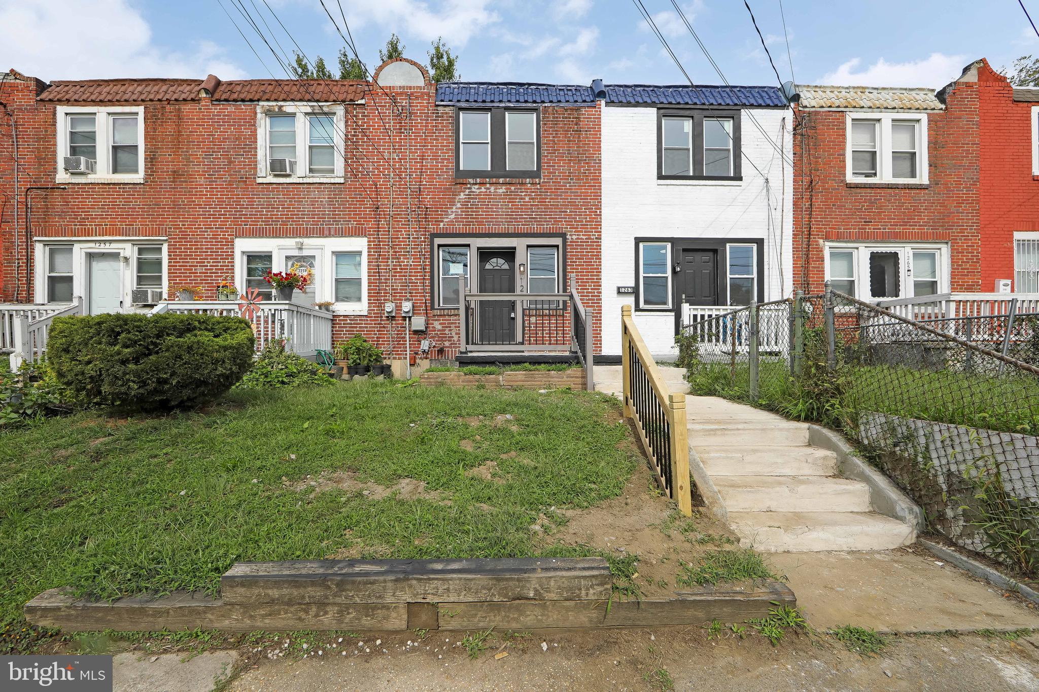 1261 South Merrimac Road Camden, NJ 08104 - Photo 21 of 27 a view of a brick building next to a yard