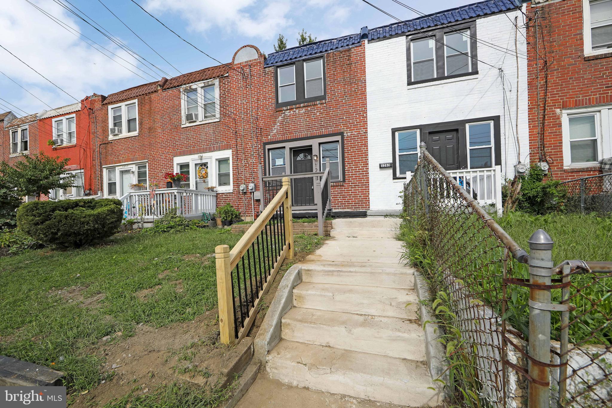 1261 South Merrimac Road Camden, NJ 08104 - Photo 22 of 27 a front view of a house with a yard